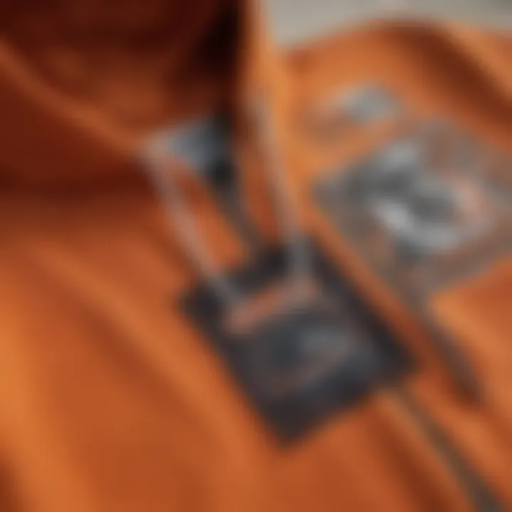 Detailed view of the stitching and design elements of the hoodie