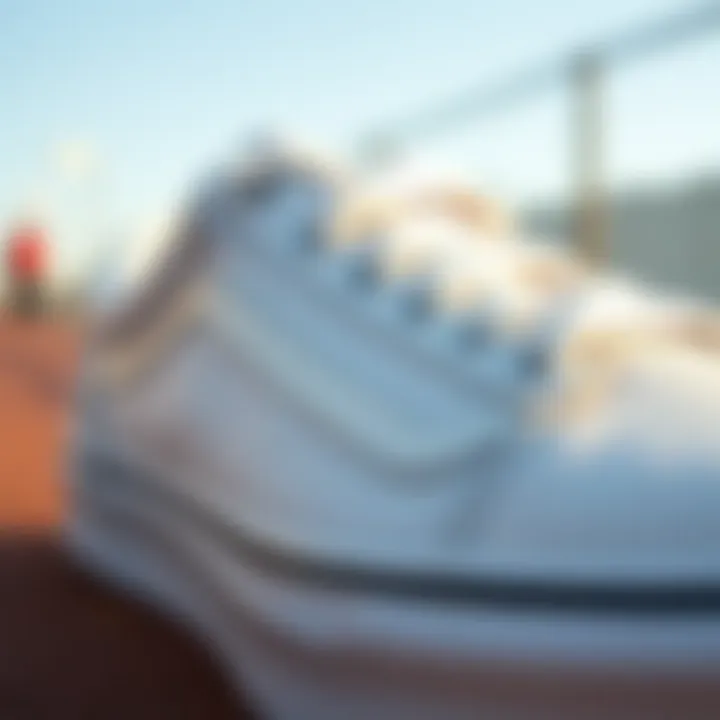 Close-up of the design features of white low top Vans