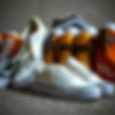 A collection of white low top Vans alongside other skate footwear