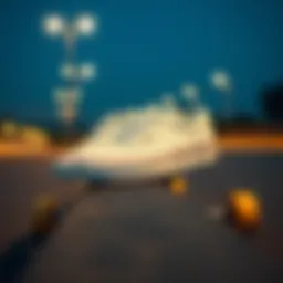 A stylish pair of all-white Vans placed on a skateboard