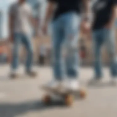 A group of skateboarders wearing light blue ripped jeans during an urban skate session