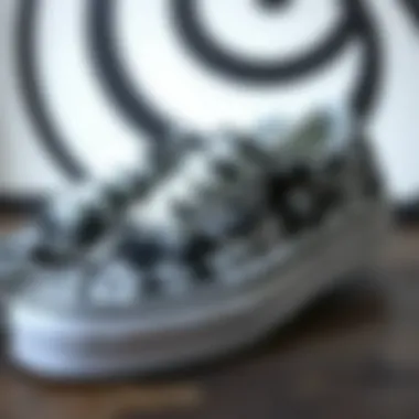 Floral Pattern Detail on Black and White Vans Close-up view of the floral pattern on Vans sneakers with contrasting background