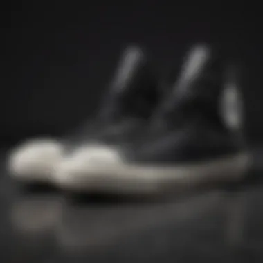 The Timeless Design of Converse Sneakers Close-up shot of black high top Converse sneakers on a textured surface