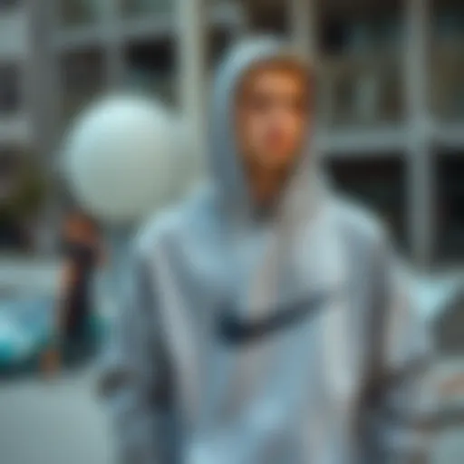 A stylish grey Mike hoodie showcased in an urban skatepark setting