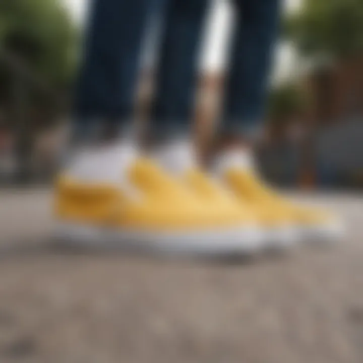 A close-up view of mustard yellow slip-on Vans showcasing the unique texture and design