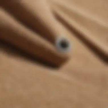 Close-up of beige corduroy fabric showcasing its texture and design.