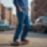 A stylish man wearing blue corduroy pants in an urban setting