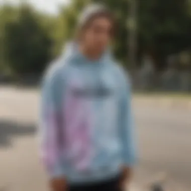 Skateboarder showcasing unique style with a bleach tie dye hoodie