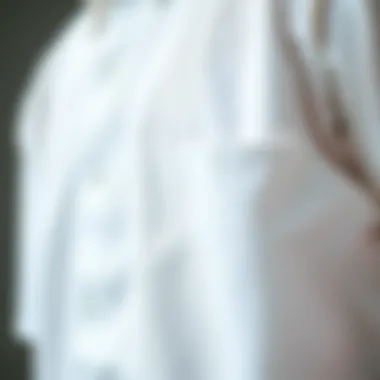 Close-up of fabric texture of a white short sleeve button-up shirt