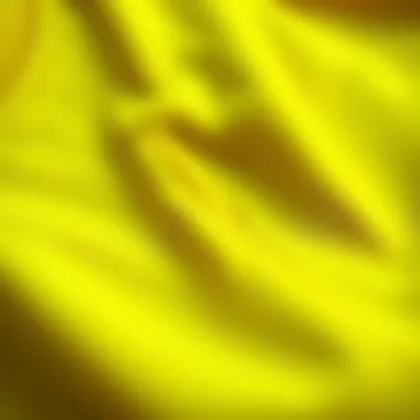 Close-up of fabric texture and stitching of a yellow crop shirt