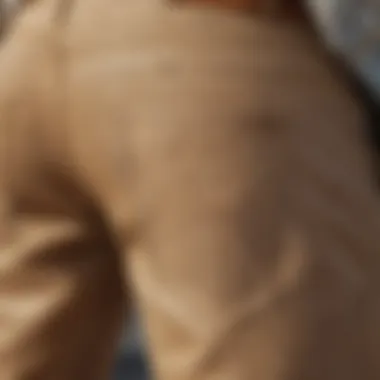 Close-up of light brown jeans highlighting texture and design