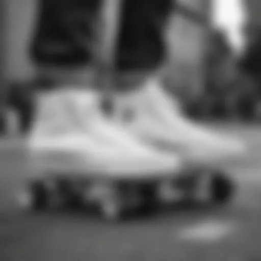 Close-up of white monochrome Converse shoes on a skateboard