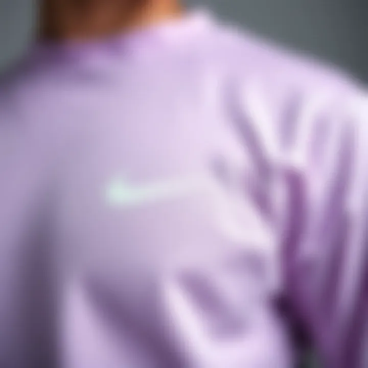 Close-up of fabric and design features of the lavender Nike shirt