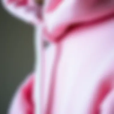 Fabric Details: Pastel Pink Hoodie Close-up of the fabric texture of a pastel pink hoodie