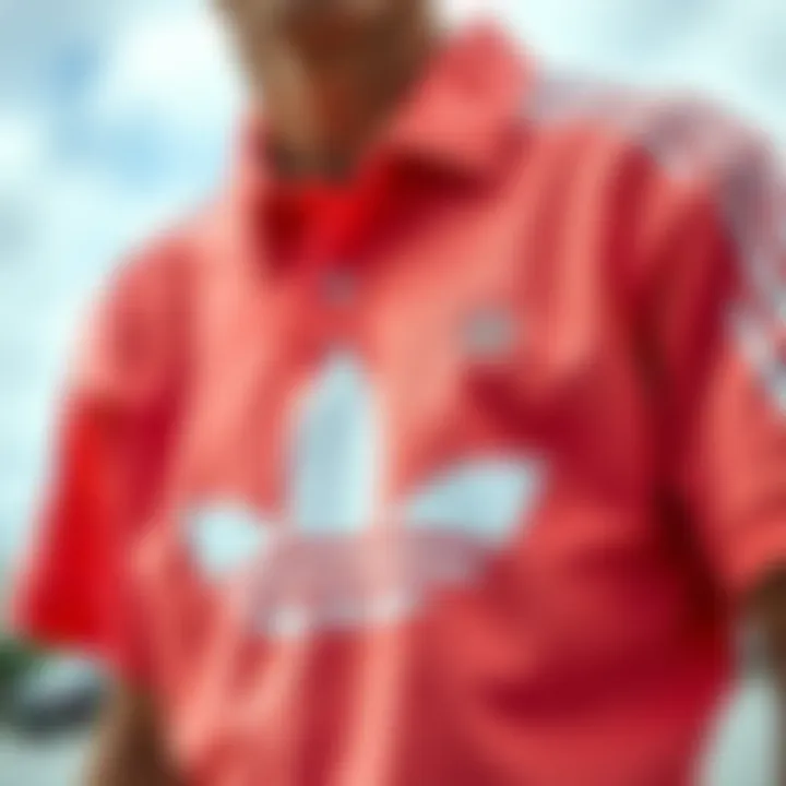 Aesthetic Features of the Peach Adidas Shirt Detailed view of peach Adidas shirt design elements