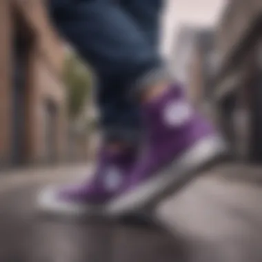 Lifestyle shot of black and purple Converse high tops in an urban setting