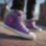 Black and purple Converse high tops styled with skate gear