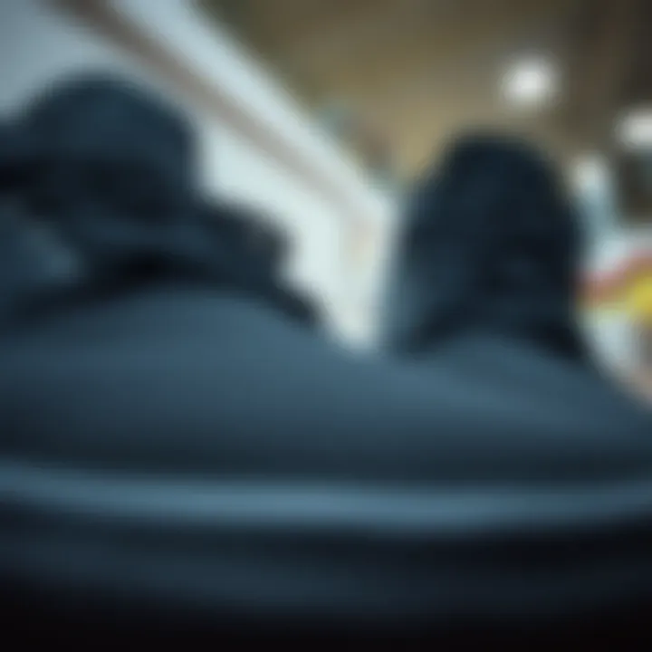 Close-up of all black hi-top Vans showcasing details