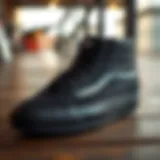 Sleek design of all black hi-top Vans on a wooden surface