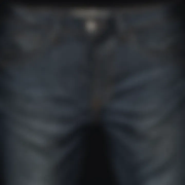 Close-up of dark wash tapered jeans showcasing texture and detail