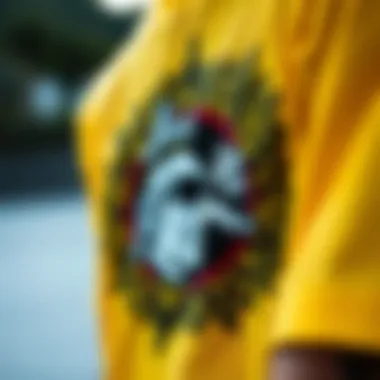 Close-up of intricate graphics on a yellow and white graphic tee