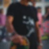 A black t-shirt featuring a unique skateboarding graphic.