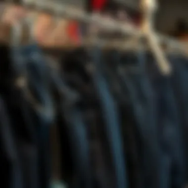 Diverse styles of dark blue jeans displayed on a rack