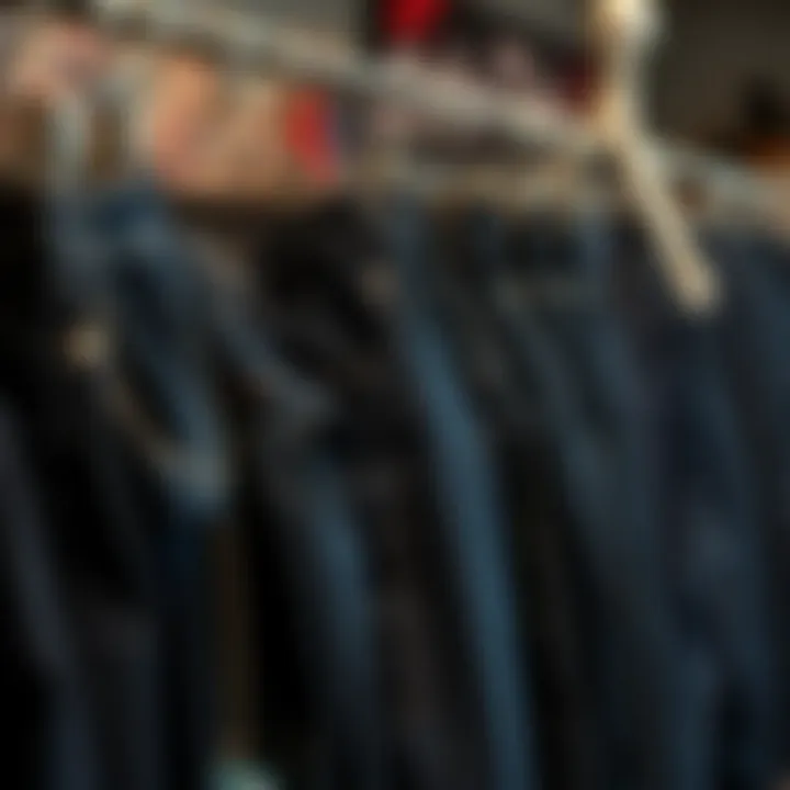 Diverse styles of dark blue jeans displayed on a rack