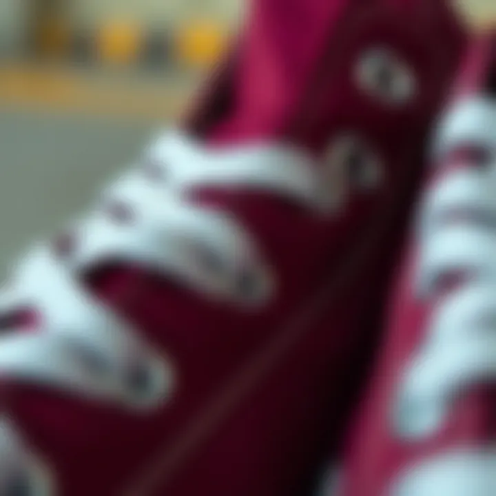 Close-up of maroon Chuck Taylor Converse laces and stitching