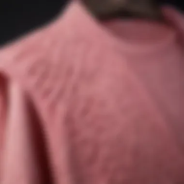 Close-up of the intricate texture and craftsmanship of a pink knit vest