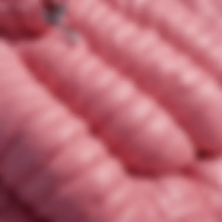 Close-up of pink puffer jacket fabric highlighting texture and quality