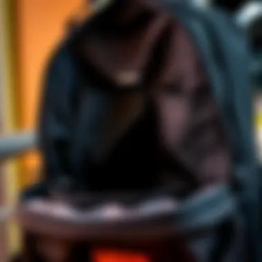 A close-up of the interior compartments of the Vans Skool'd backpack, showcasing its organizational features.